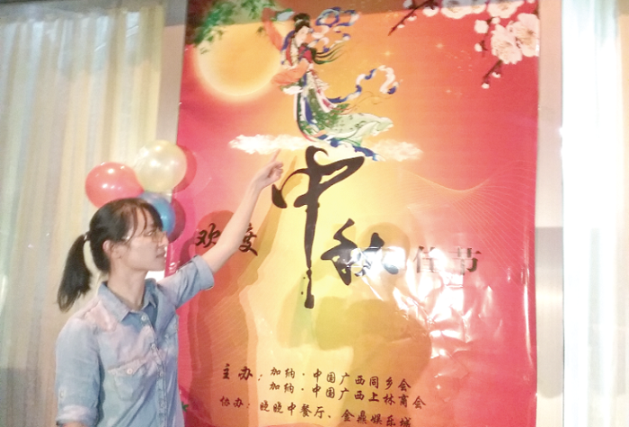  Monica Wei explaining pictorial symbols relating to romanticism, peace and good luck attached to the celebration of the Moon Festival 